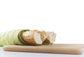 Long baguette broken into pieces on white background Royalty Free Stock Photo