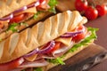 Long baguette sandwich with ham cheese tomato and lettuce