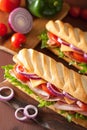 Long baguette sandwich with ham cheese tomato lettuce Royalty Free Stock Photo