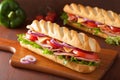 Long baguette sandwich with ham cheese tomato lettuce Royalty Free Stock Photo