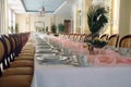 Long banquet table with flower Royalty Free Stock Photo