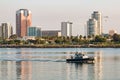 Long Beach Harbor Police Boat Patrolling Through Harbor with City Skyline Royalty Free Stock Photo