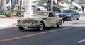 Long Beach, California USA - April 12, 2021: antique light beige retro car cabriolet side view.