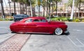 Long Beach, California USA - April 11, 2021: red chevrolet kustom famous luxury car side view. Royalty Free Stock Photo