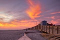 Long Beach, New York - December 13 2020 : Vibrant colorful sunset over the Long Beach boardwalk ramp and stairs.