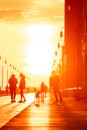 Long Beach, New York - March 19, 2019 : Silhouettes of people on the boardwalk at sunset Royalty Free Stock Photo