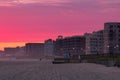Vibrant sunset glow over the beach and boardwalk in Long Beach New York.