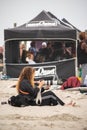 Long Beach, New York - September 13, 2018 : Unsound Pro photographer on the beach near an the event tent. Royalty Free Stock Photo