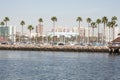 Long beach shoreline with cityscape in the background.