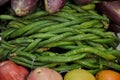 Long beans against a backdrop of eggplants and guavas Royalty Free Stock Photo