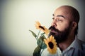 Long beard and mustache man giving flowers Royalty Free Stock Photo