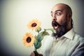 Long beard and mustache man giving flowers Royalty Free Stock Photo