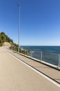 A long bike path overlooking the sea with no one around Royalty Free Stock Photo