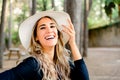 Long blond hair young woman with straw hat, laughing very pretty Royalty Free Stock Photo