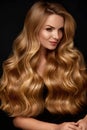 Long Blonde Hair. Woman With Wavy Hairstyle, Beauty Face Royalty Free Stock Photo