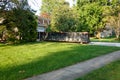 Long blue dumpster full of wood and other debris in the driveway in front of a house in the suburbs that is being renovated Royalty Free Stock Photo