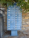 Long blue mailbox in the Cyclade Islands in Greece. Royalty Free Stock Photo