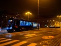Long blue tram ride through the Kosciuszki square at night