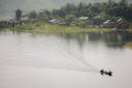 Long boat is floating on river in dam Royalty Free Stock Photo