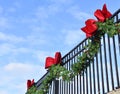 Pine Bough and Red Bows on Wrought Iron Fence 2