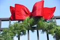 Pine Bough and Red Bows on Wrought Iron Fence 1