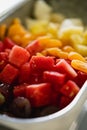 a long bowl of Fresh Fruit salad in close up view