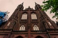 Long brick facade of a gothic cathedral