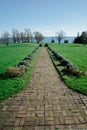 Long Brick Path Through Green Lawn