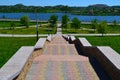 A long brick, stone staircase descends to the blue river. Summer photography Royalty Free Stock Photo