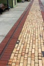 Interesting design in brick walkway in downtown area shows off the craftsmanship of brick layer Royalty Free Stock Photo