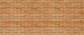 Long brick wall texture background in orange brown color