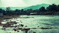 Long bridge across small lake river in the mountain forest in summer Royalty Free Stock Photo