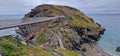 Long bridge connecting two large cliffs by the sea Royalty Free Stock Photo