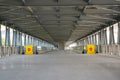 Long Bridge Corridor, Yellow fence with a brick sign, passage is prohibited on a travelator, an elevated pedestrian Royalty Free Stock Photo