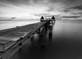 The long bridge over the sea with a beautiful sunrise in black a Royalty Free Stock Photo