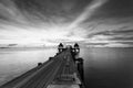 The long bridge over the sea with a beautiful sunrise in black a Royalty Free Stock Photo