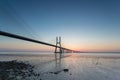 Long bridge over tagus river in Lisbon at sunrise Royalty Free Stock Photo