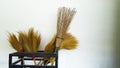 Long brown coconut broom and common brooms Royalty Free Stock Photo
