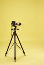 Long camouflaged professional supertele on tripod Royalty Free Stock Photo