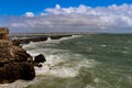 Long cement pier by the sea.