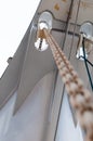 A long chain with reel from the front deck of the boat