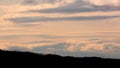 Long Clouds and Mountains under Sunset Royalty Free Stock Photo