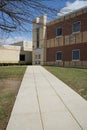 Long concrete sidewalk by a school