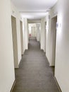 Long coridor of hotel with many doors