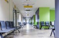 Corridor with chairs for patients in modern hospital