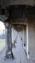 A long corridor with a colonnade. Old, abandoned building of the Khmer Empire