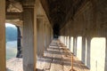 A long corridor with a colonnade. Old, abandoned building of the Khmer Empire