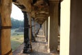 A long corridor with a colonnade. Old, abandoned building of the Khmer Empire