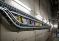A long corridor features a meticulously organized cable tray system with multicolored cables: red, Royalty Free Stock Photo