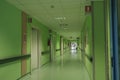 The long corridor of the hospital with doors, and rooms with medical equipment and hospital furniture. Royalty Free Stock Photo